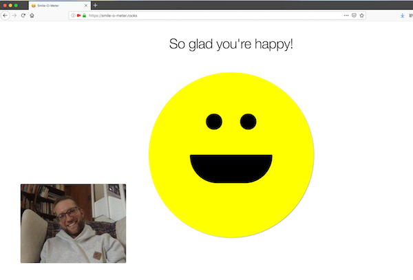 A screenshot of the Smile-O-Meter an open source project with a smiley that smiles when you do.